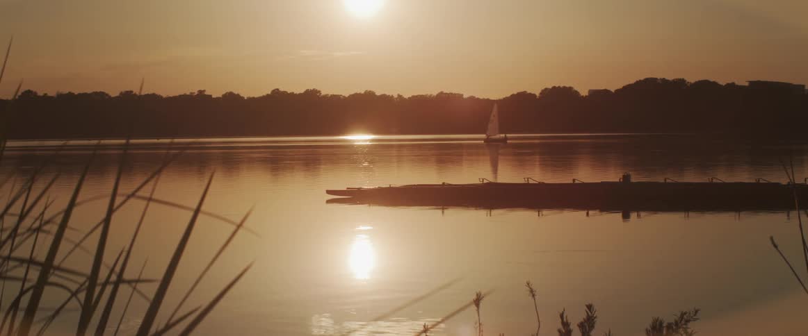 A boat on a lake at dusk