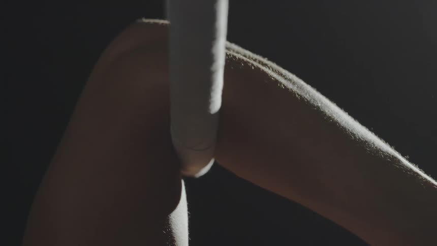 A person is hanging from the ring