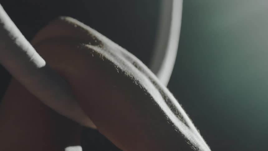 Person putting arm in ring