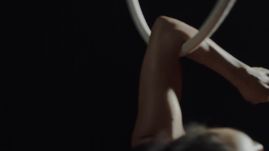 A woman doing gymnastics with a large ring