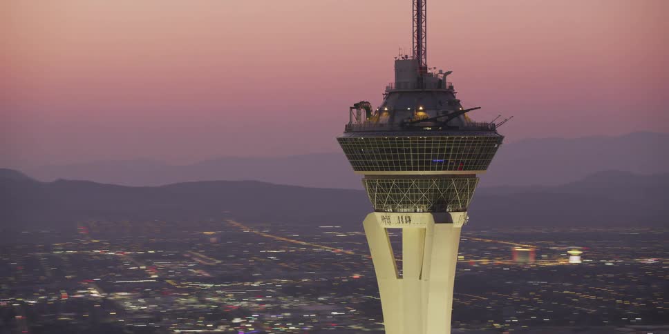 An aerial view of a tower at sunset