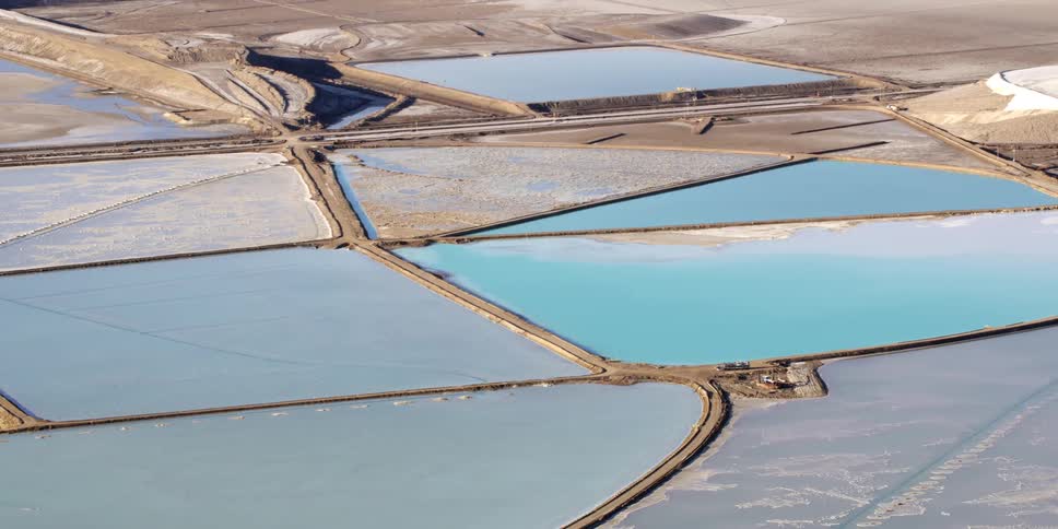 Roads and sand divide evaporation ponds with different levels of water