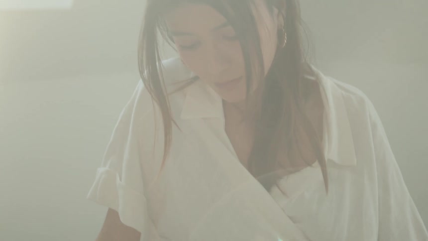 A woman sitting in bed reading a book