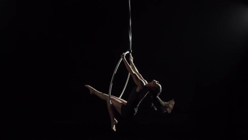 Woman sitting on hoop