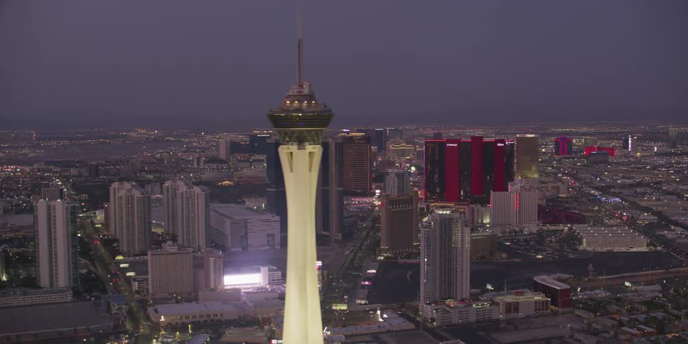 The stratosphere tower with las vegas casinos and hotels glowing and shining at night