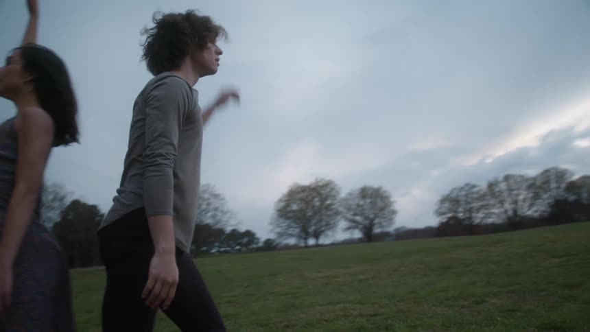 A couple dance together on the field