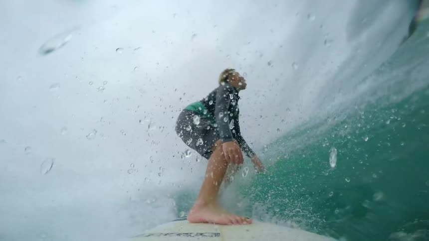 A boy surfing on the water