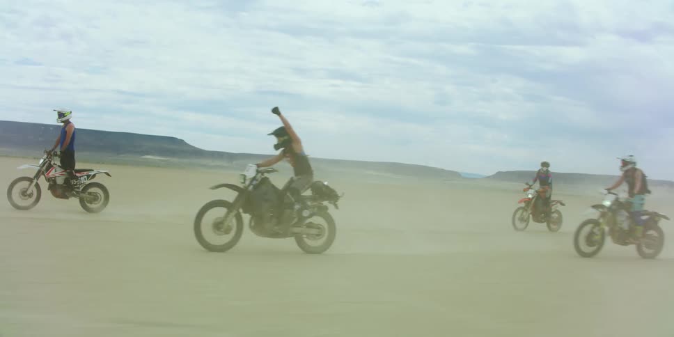 People riding dirt bikes