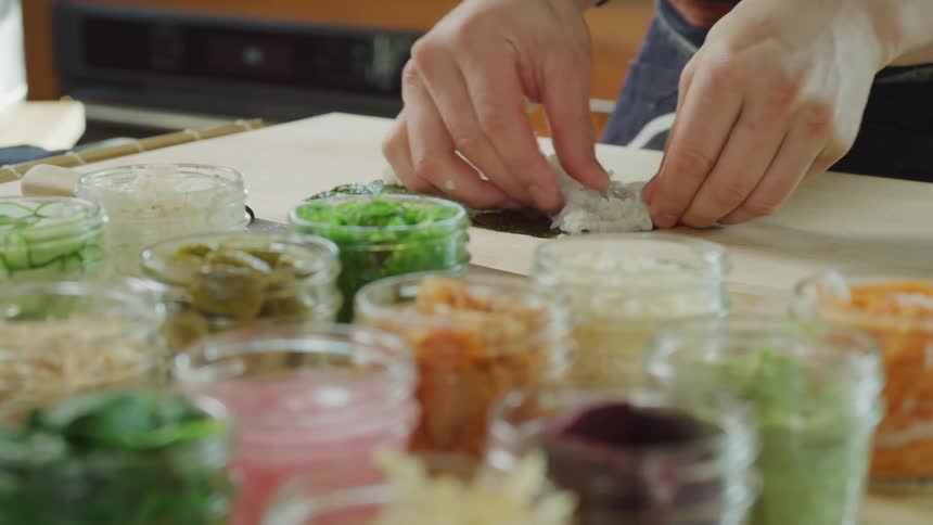 Person preparing sushi