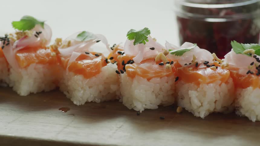 A row of sushi is displayed
