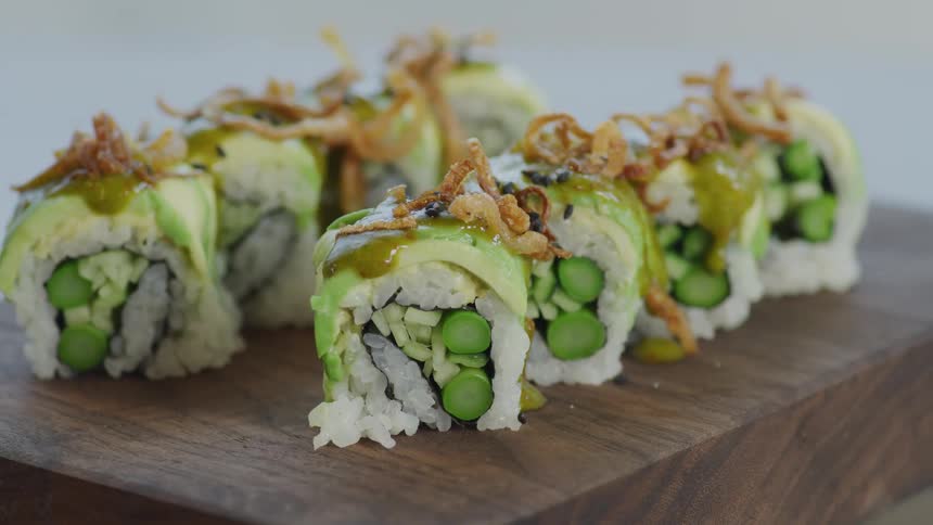 A view of sushi sitting on a cutting board