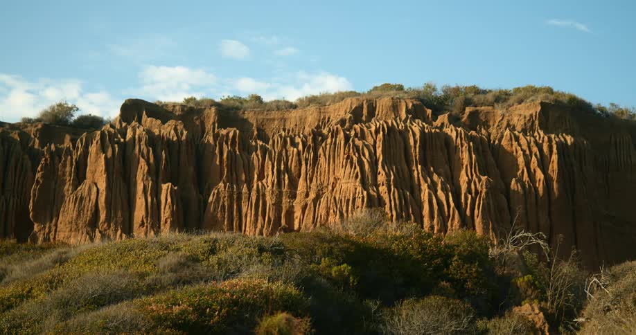 A rocky cliff on a hillside