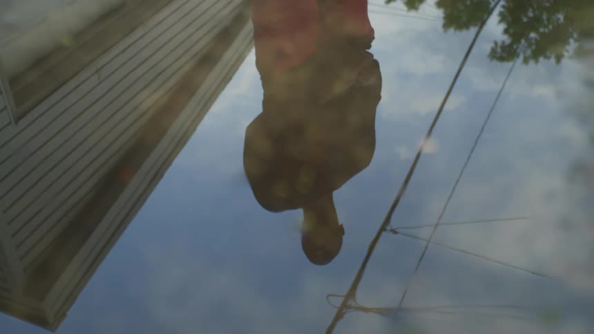 Man house and sky are reflected