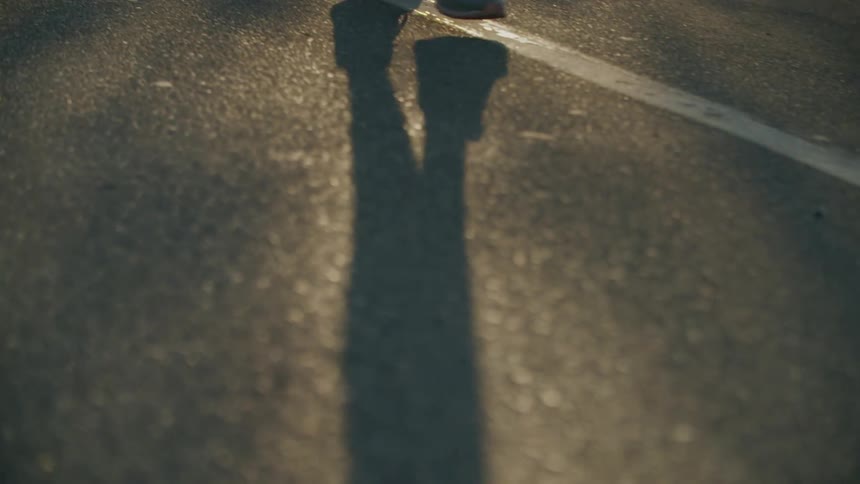 A person walking in slow motion outdoors