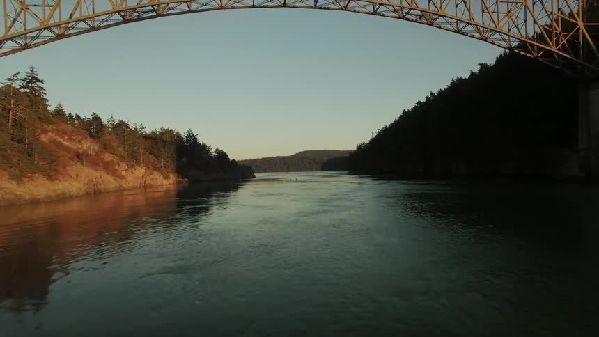 Moving towards a bridge with cars driving above