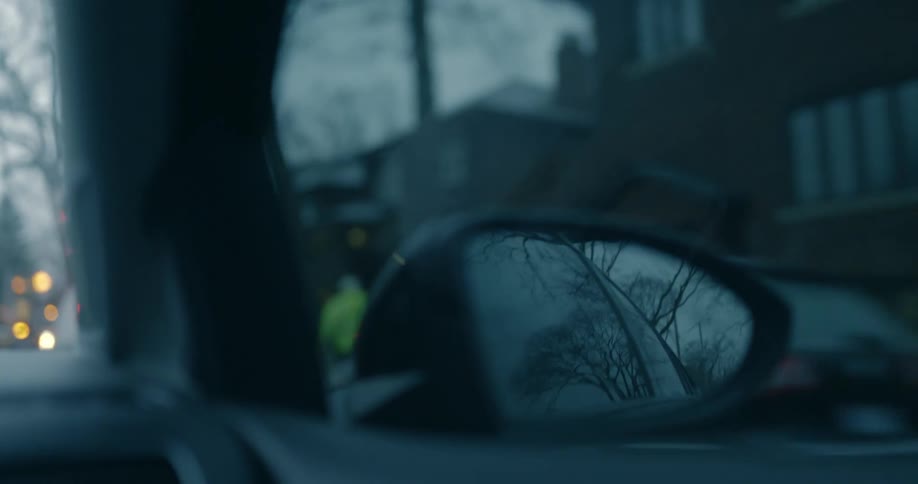 A vehicle is driving through the neighborhood