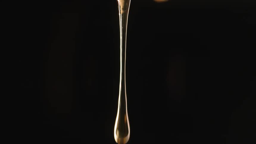 A gel dripping with a black background