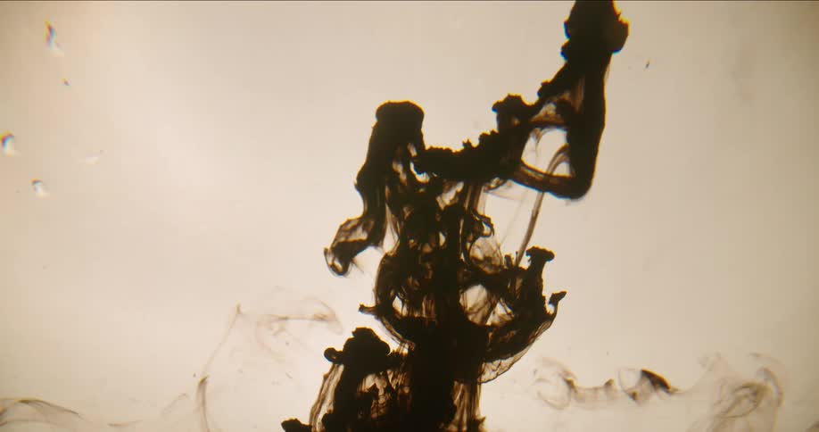 Brown dye rises and expands in liquid
