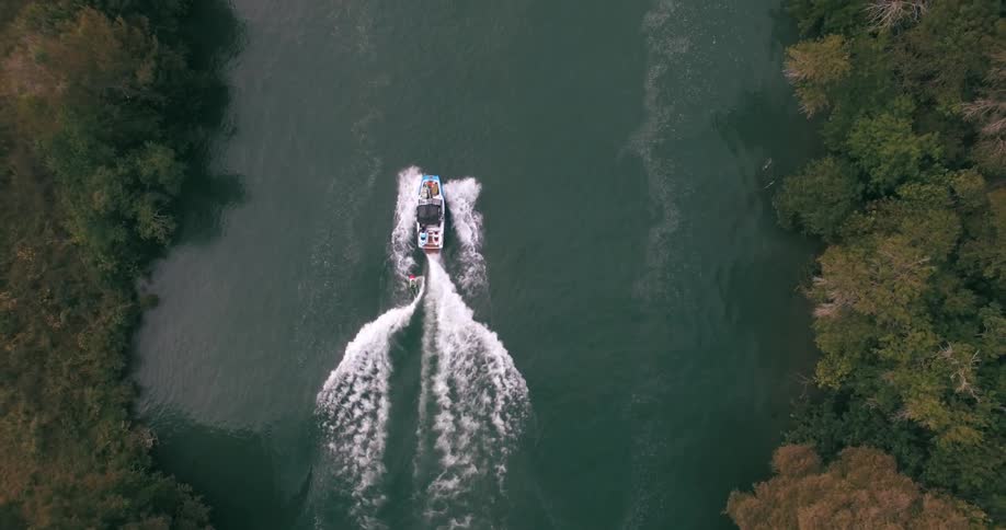A boat travels down the river