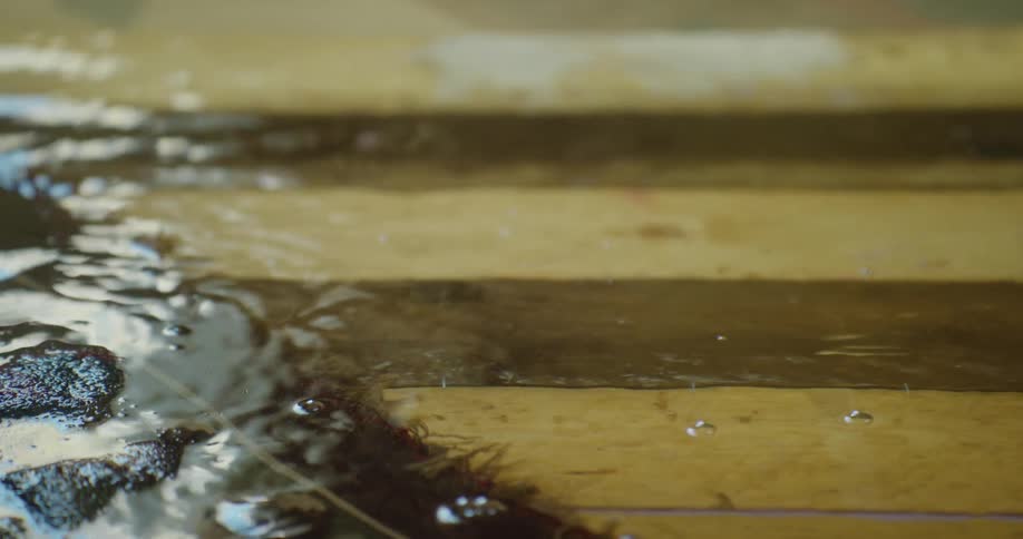 Water flowing over wood boards