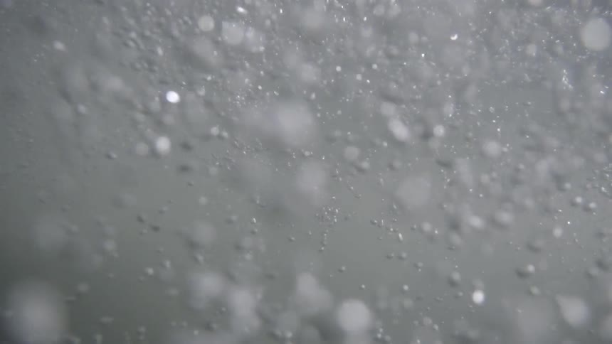 Bubbles swirl in water