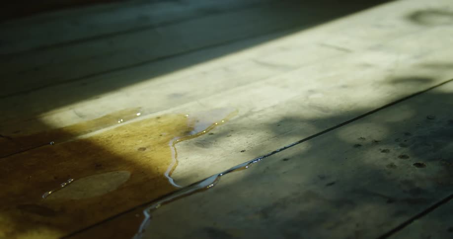 A view of water rolling across wood