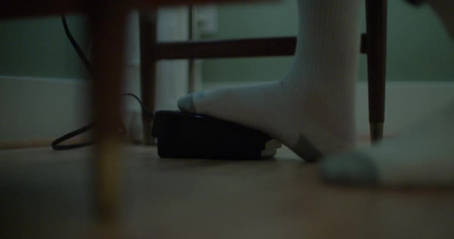 Person pushing a pedal