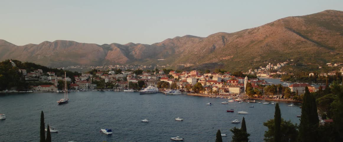 An aerial view of some boats on a cove