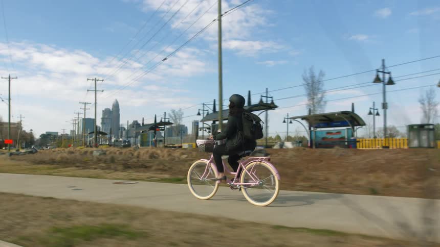 Person biking outdoors