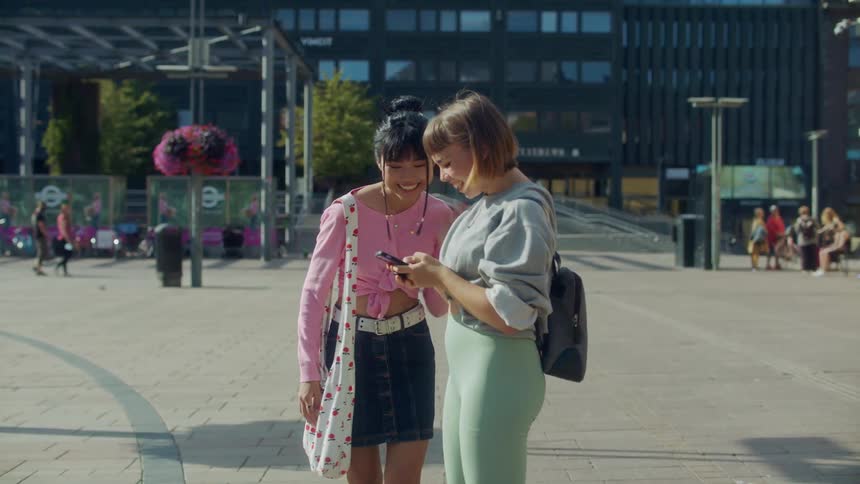 Two women hugging each other outdoors