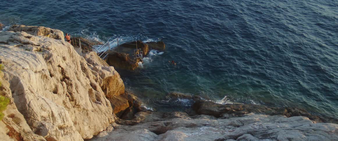 Ocean waves crashing into a rocky shoreline