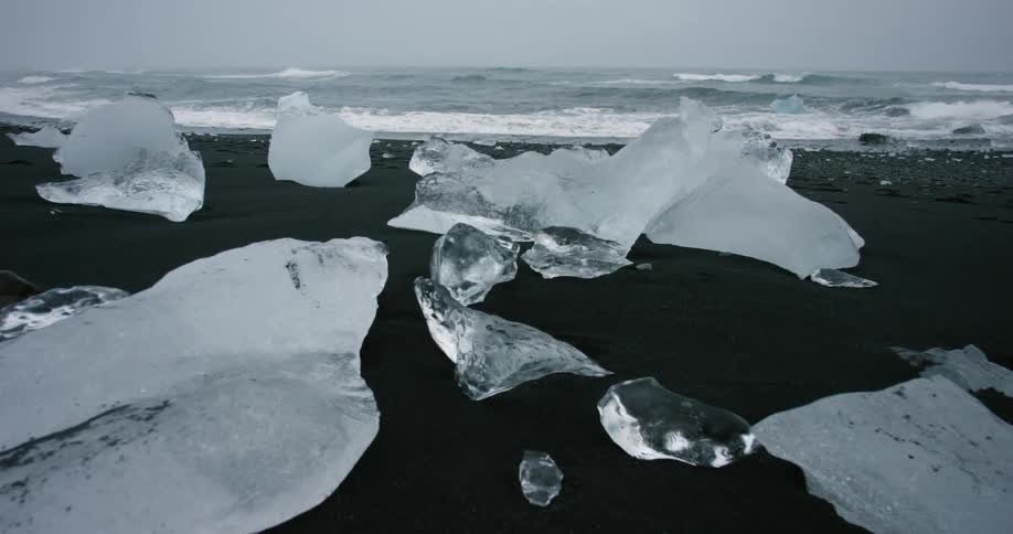 Large pieces of ice sit on the shore