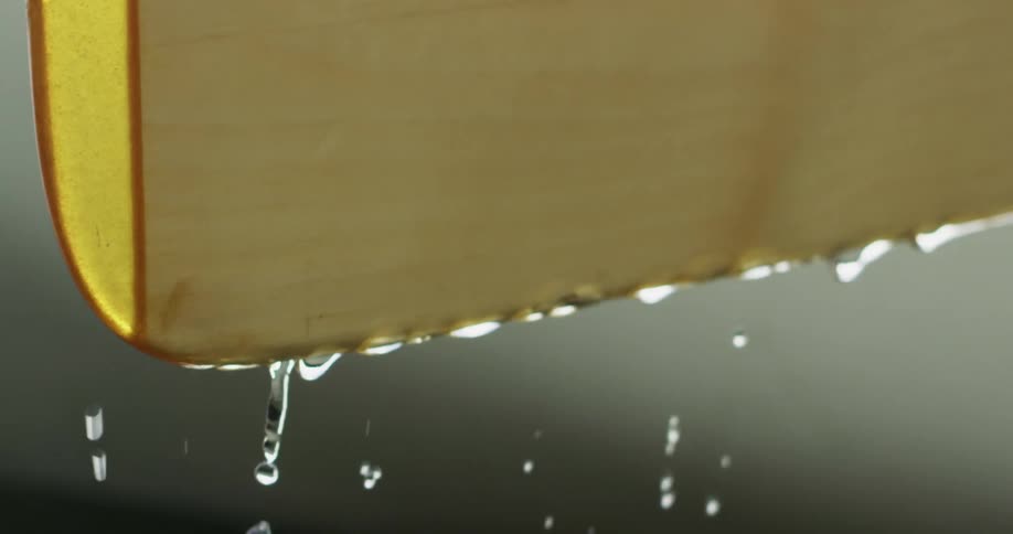 Water drips slowly from the fabric