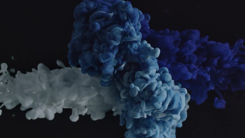 Blue and white liquids flow across black background merging and mixing into various shades of blue
