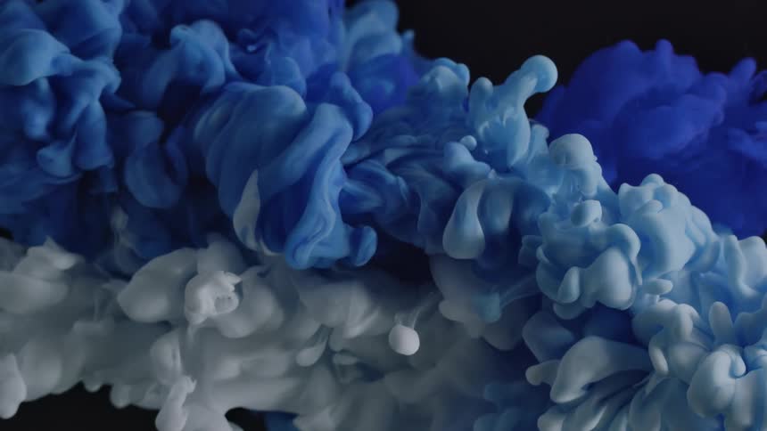 A cloud of white smoke and a cloud of blue smoke are propelled at each other and mix in a surreal scene