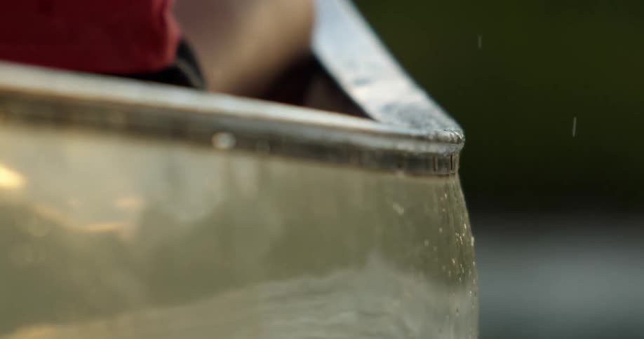 Water splashes from the person rowing a boat