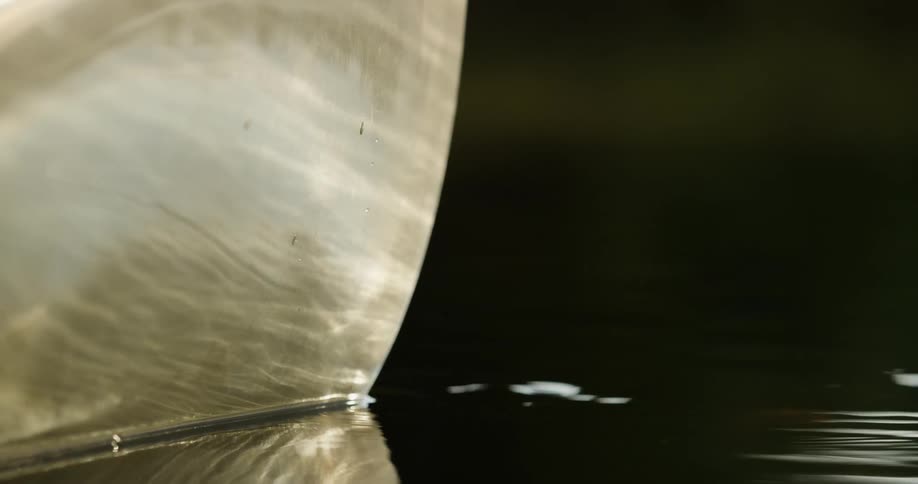 A view of a ship hull against the water in a river