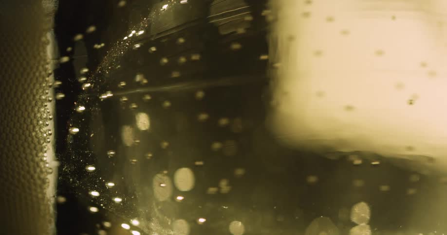 The bubbles slowly move in the alcohol