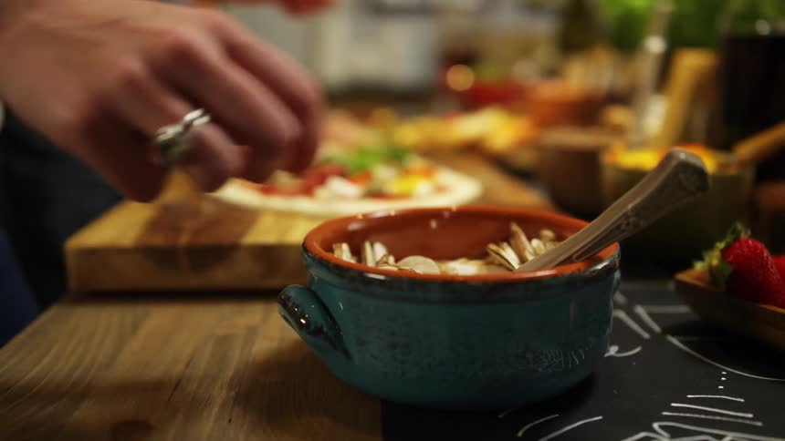 A person is preparing food in a kitchen