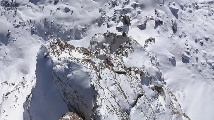 Aerial view of a snow covered mountain peak