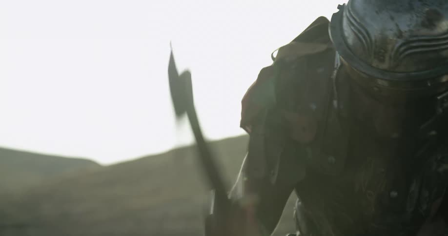 Roman soldier hammering a nail with a hammer on the hills