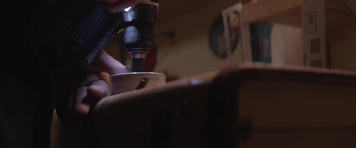 A tool is used to drill a hole in a chest