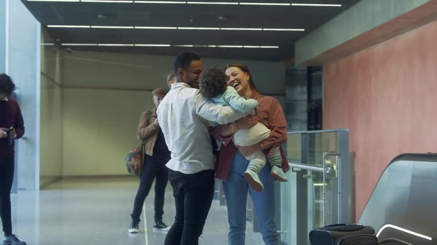 A family are united at the airport terminal