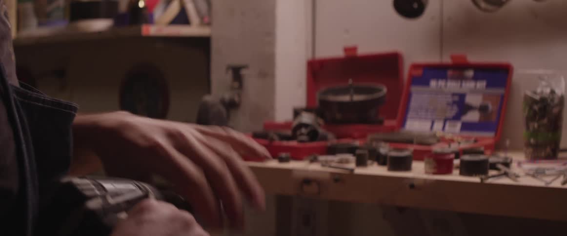 A man is preparing a drill for use