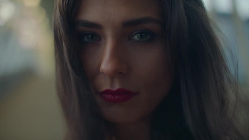 A woman standing and looking into the camera