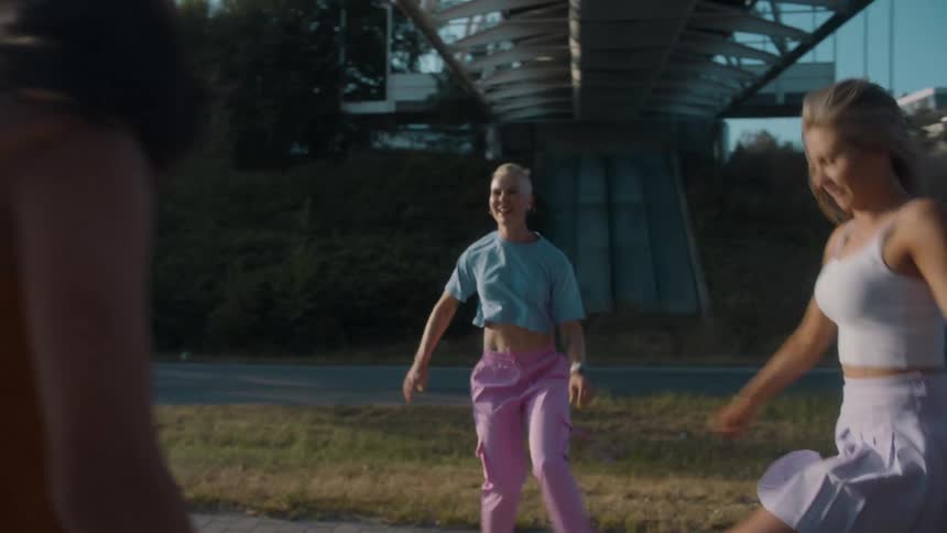 A group of dancers on a sidewalk