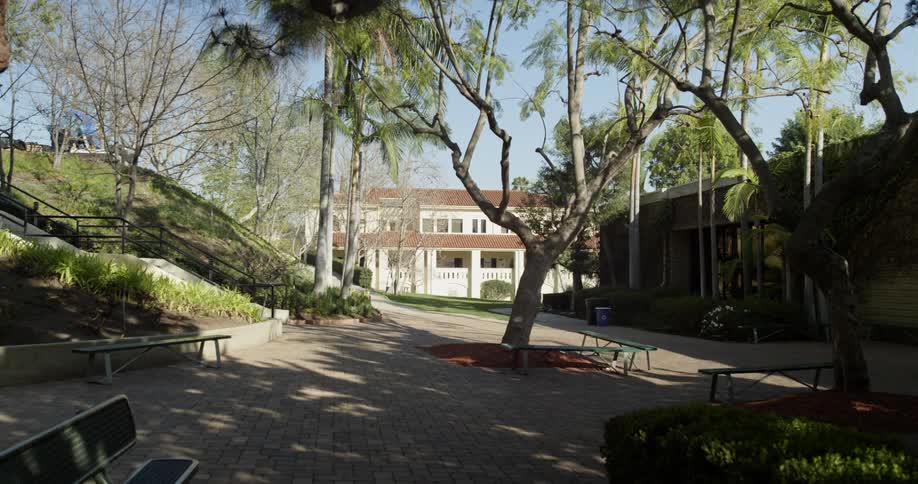 A walkway leads to apartment buildings