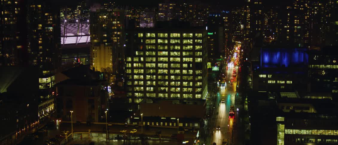 Vehicles driving on the city street at night