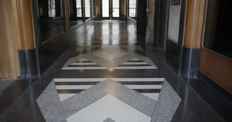 Designs on the floor of the hallway of a building