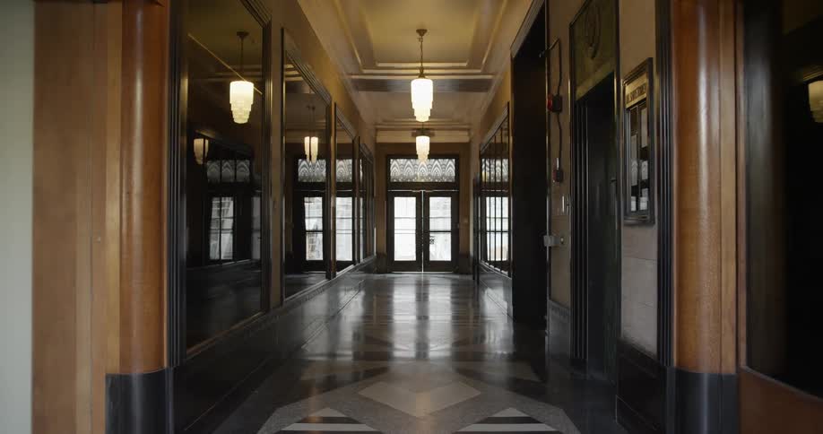 Long ornate corridor in the lobby of a building near the entrance doors